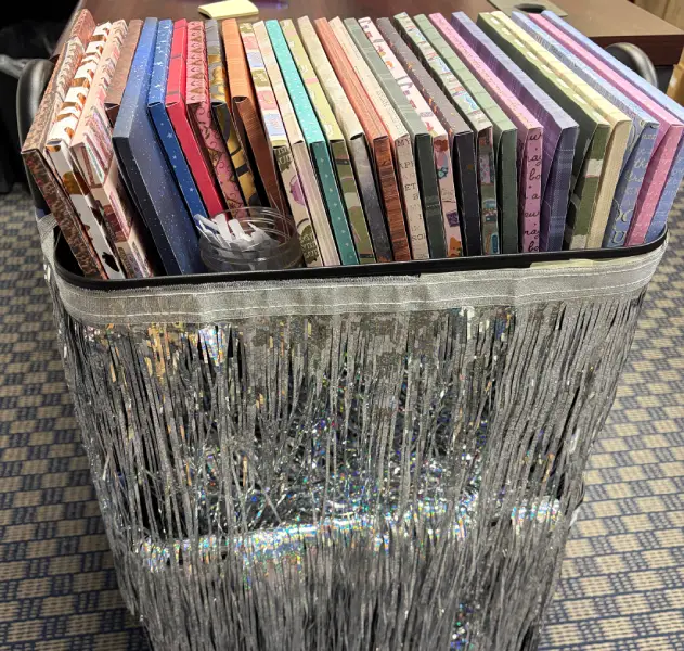 Illustration of a ringed space station that you can see inside with various agricultural and suburban-sprawl type of landscapes.